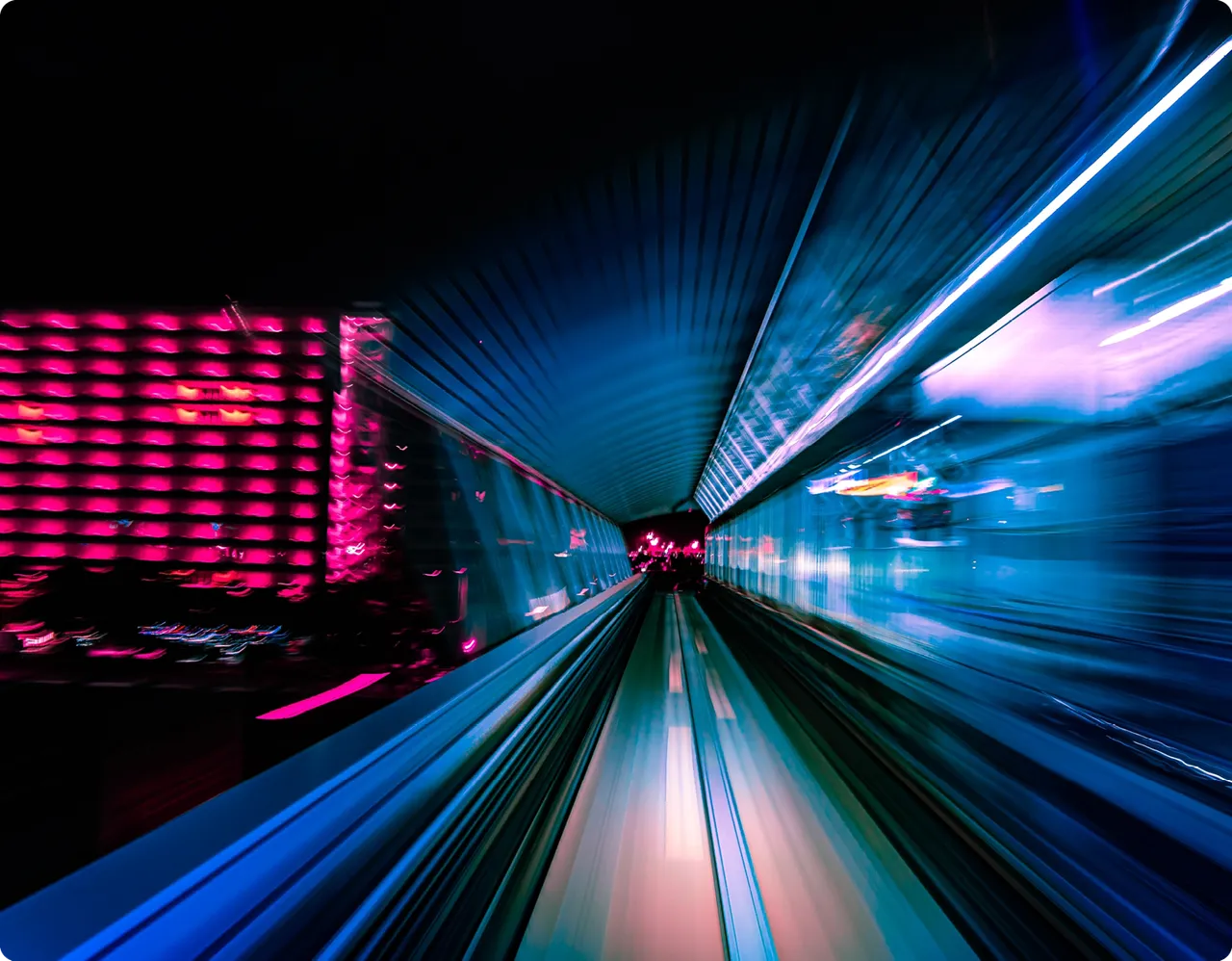 Futuristic transit tunnel with motion light trails